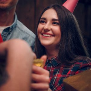 Geburtstag_0003_excited-and-cheerful-young-girl-in-a-party-hat-smiles-and-enjoys-her-time-at-a-birthday-party