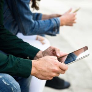 Weitere_0007_young-unrecognizable-people-using-smartphone-and-tablet-computer