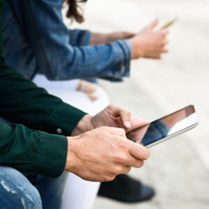 Outdoor_0004_young-unrecognizable-people-using-smartphone-and-tablet-computer